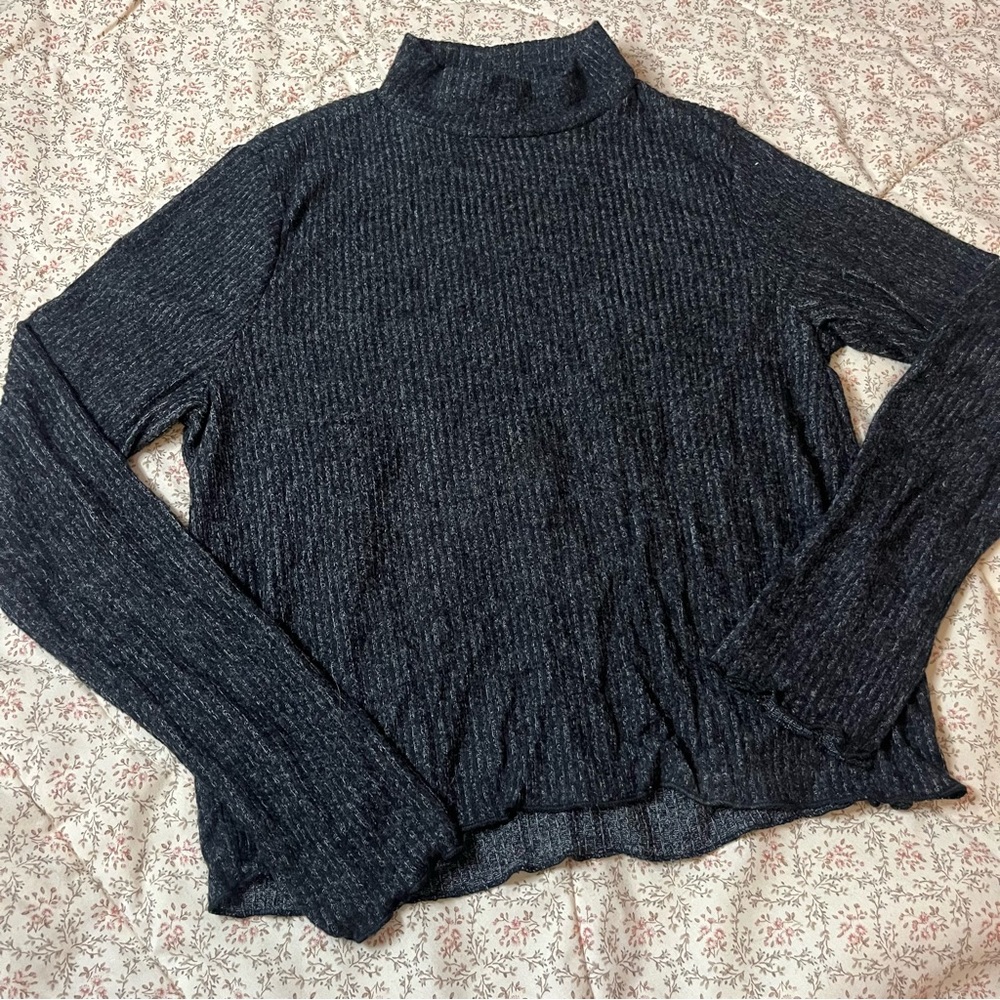 Ripped turtleneck sweater